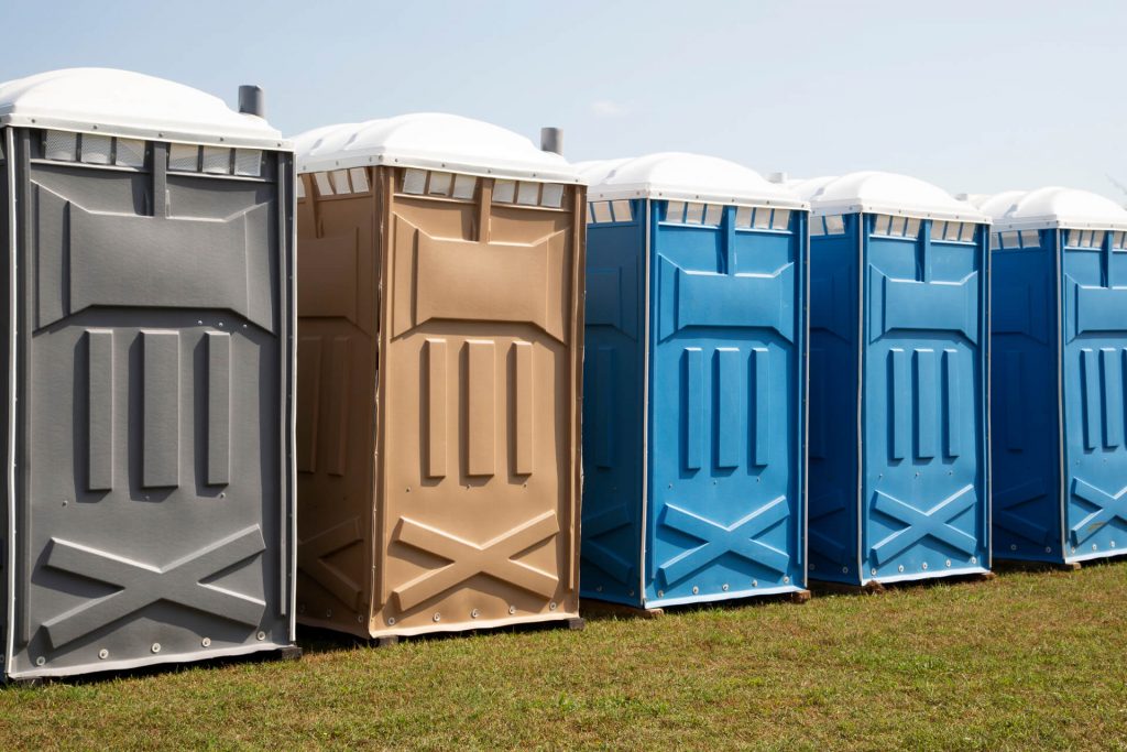 Row Of Colorful Porta Potty Rentals In Dallas Texas