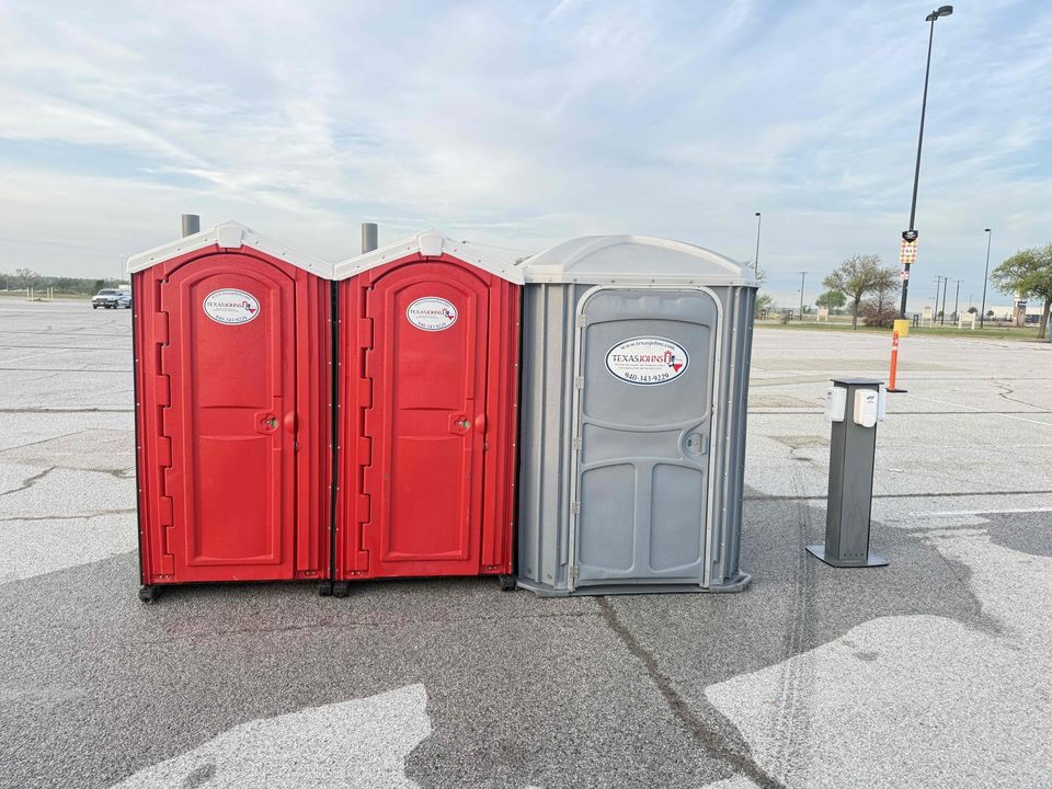 Standard Porta Potty and Handicap Porta Potty rental with Hand Sanitizer placed on the side