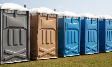 Row Of Colorful Porta Potty Rentals In Dallas Texas