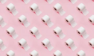 toilet paper on a pink background