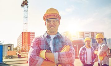 Happy-Construction-Worker-at-Sanitary-Construction Site